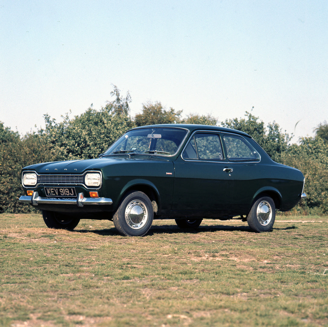 This archival image documents the 1971 Ford Escort Mark I 1300 XL 2 Door in scenic field and is preserved in the Ford Heritage Vault as part of Ford Motor Company's historic photographic archive. Free for personal, non-commercial use. Ford Heritag...
