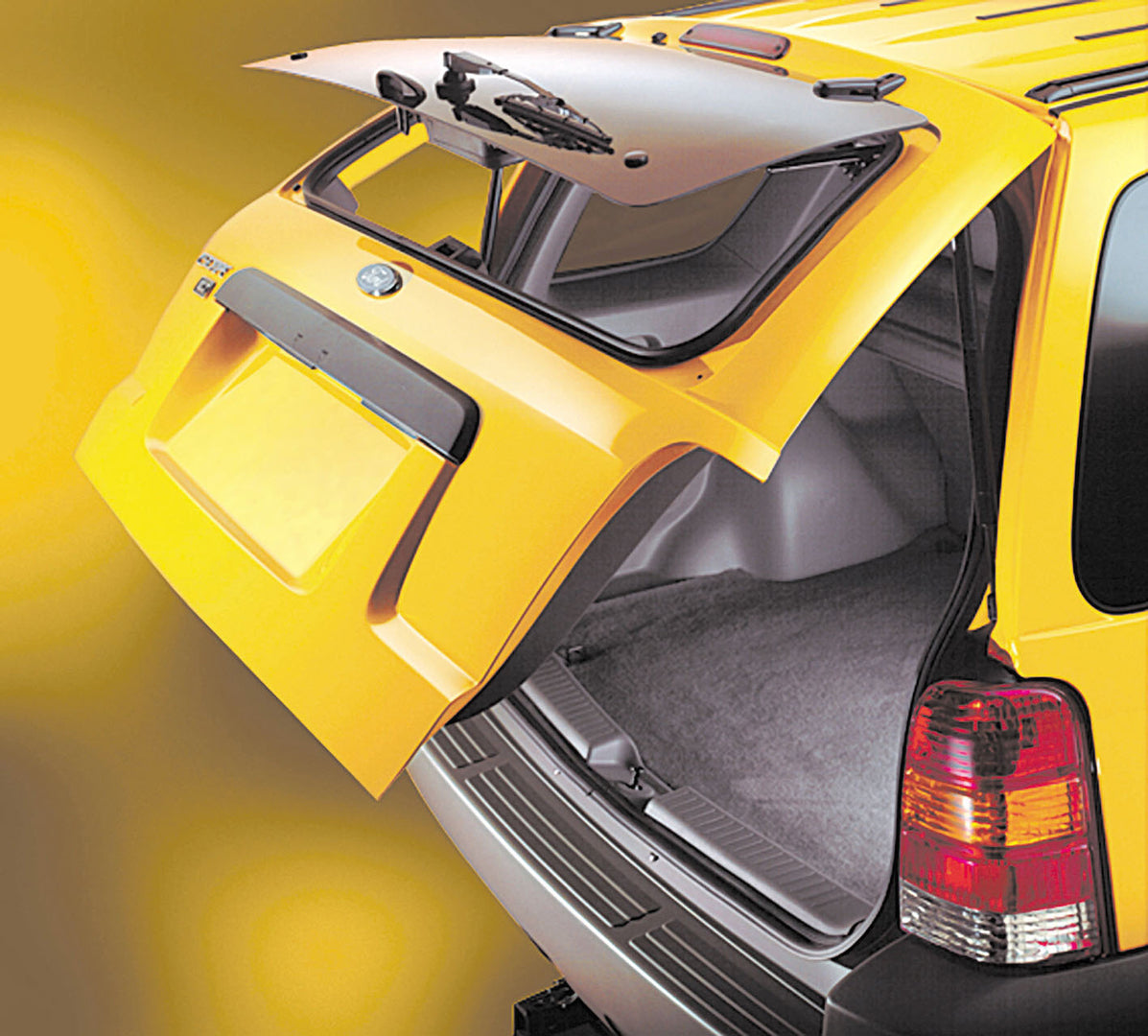 This archival image documents the 2003 Ford Escape rear closeup showing trunk in action MS9796 and is preserved in the Ford Heritage Vault as part of Ford Motor Company's historic photographic archive. Free for personal, non-commercial use. Ford H...