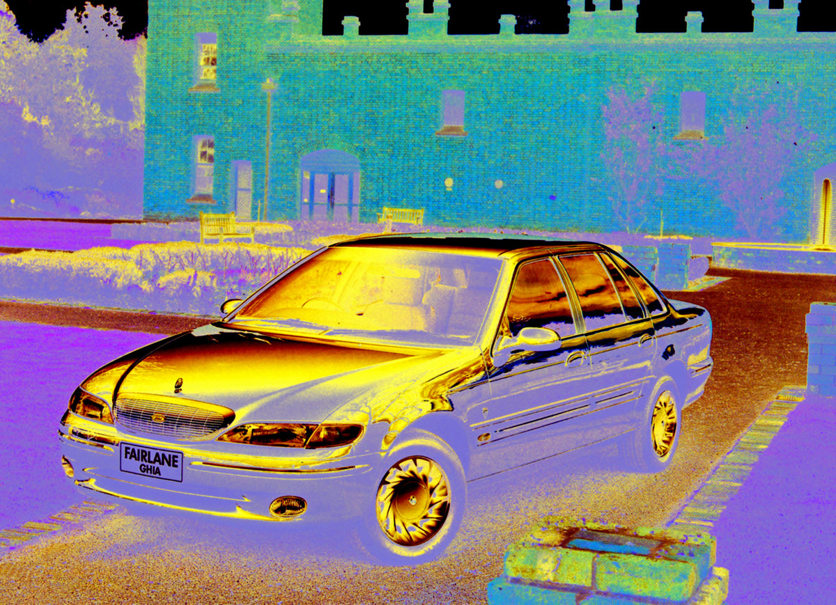 This archival image documents the 1996 Ford NL Fairlane Ghia in scenic courtyard of brick house and is preserved in the Ford Heritage Vault as part of Ford Motor Company's historic photographic archive. Free for personal, non-commercial use. Ford ...