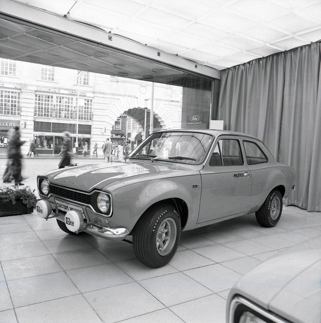 This archival image documents the 1972 Ford Escort Mexico MK1 in Regent Street Showroom and is preserved in the Ford Heritage Vault as part of Ford Motor Company's historic photographic archive. Free for personal, non-commercial use. Ford Heritage...