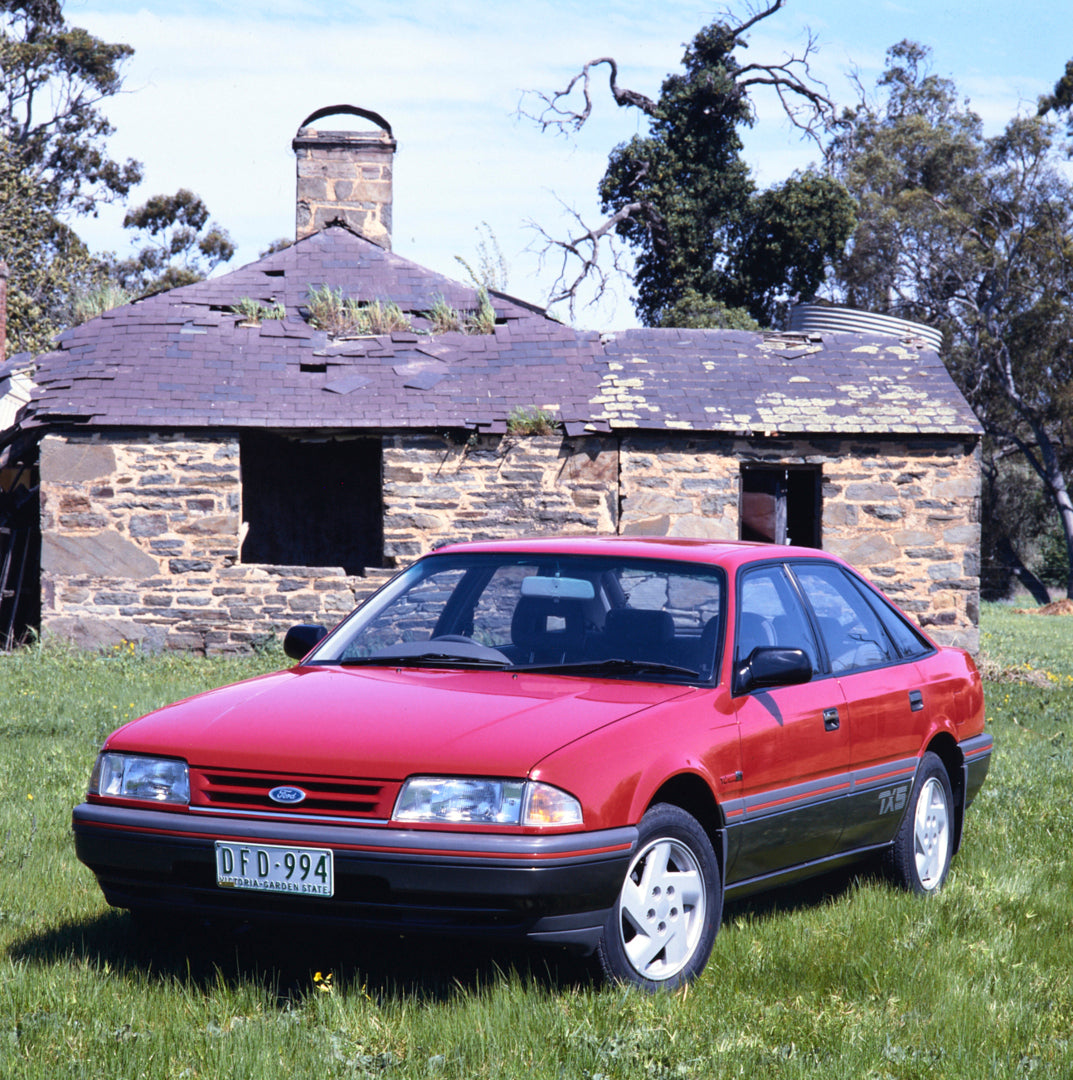 This archival image documents the 1987 Ford AT Telstar TX5 Sedan Passenger Side Front End View on Grass Lawn FAP-2011-3 and is preserved in the Ford Heritage Vault as part of Ford Motor Company's historic photographic archive. Free for personal, n...