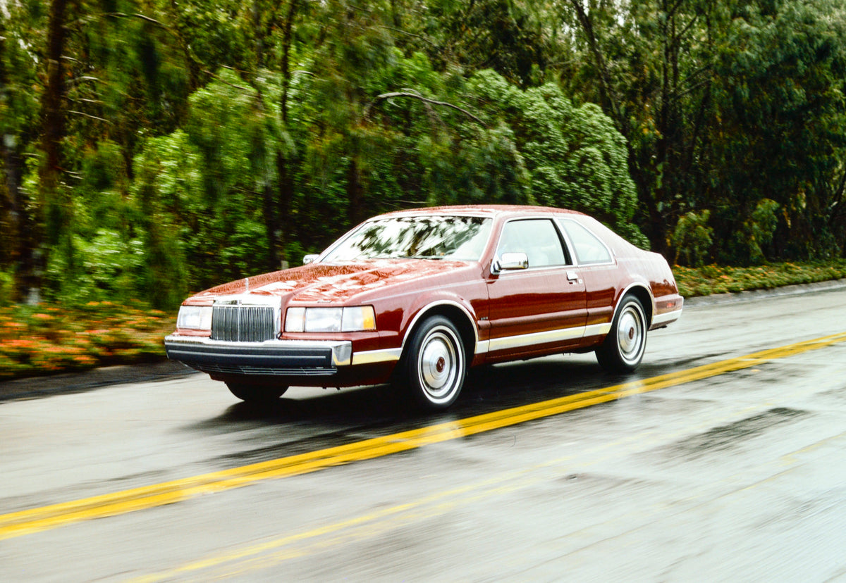 This archival image documents the 1985 Lincoln Continental Mark VII two-door and is preserved in the Ford Heritage Vault as part of Ford Motor Company's historic photographic archive. Free for personal, non-commercial use. Ford Heritage Vault refe...