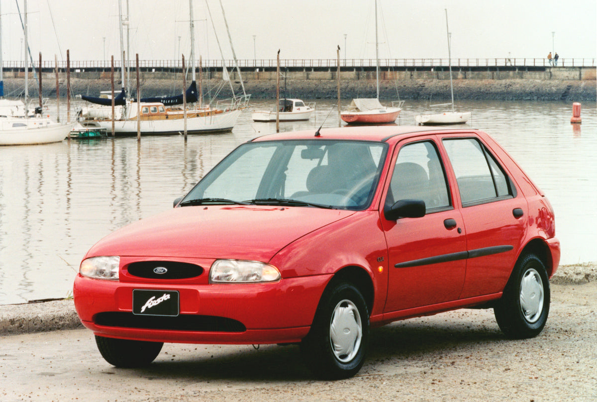 This archival image documents the 1998 Ford Fiesta in scenic harbor and is preserved in the Ford Heritage Vault as part of Ford Motor Company's historic photographic archive. Free for personal, non-commercial use. Ford Heritage Vault reference AR-...