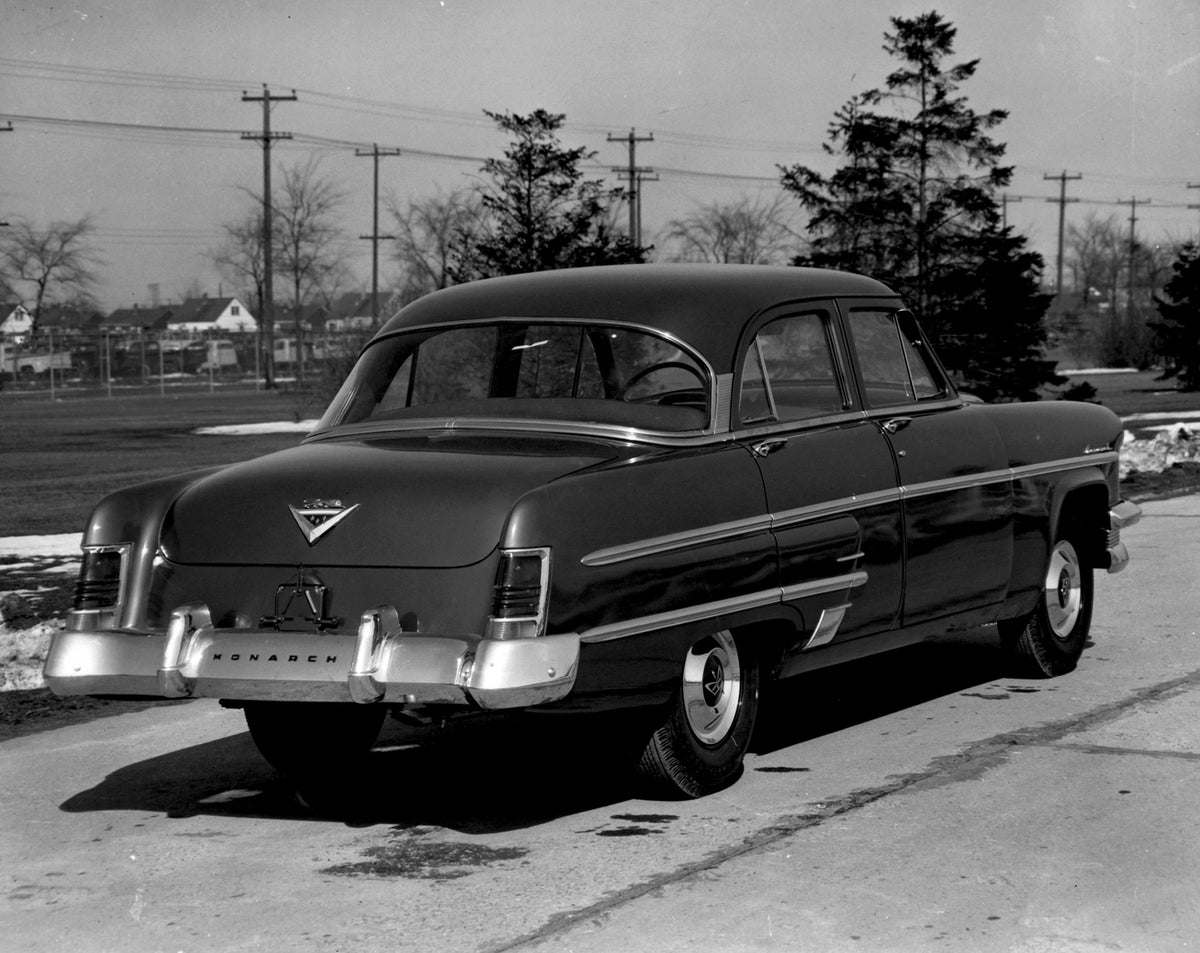 This archival image documents the 1954 Monarch Sedan rear view on scenic road with trees AR-2007-5 and is preserved in the Ford Heritage Vault as part of Ford Motor Company's historic photographic archive. Free for personal, non-commercial use. Fo...
