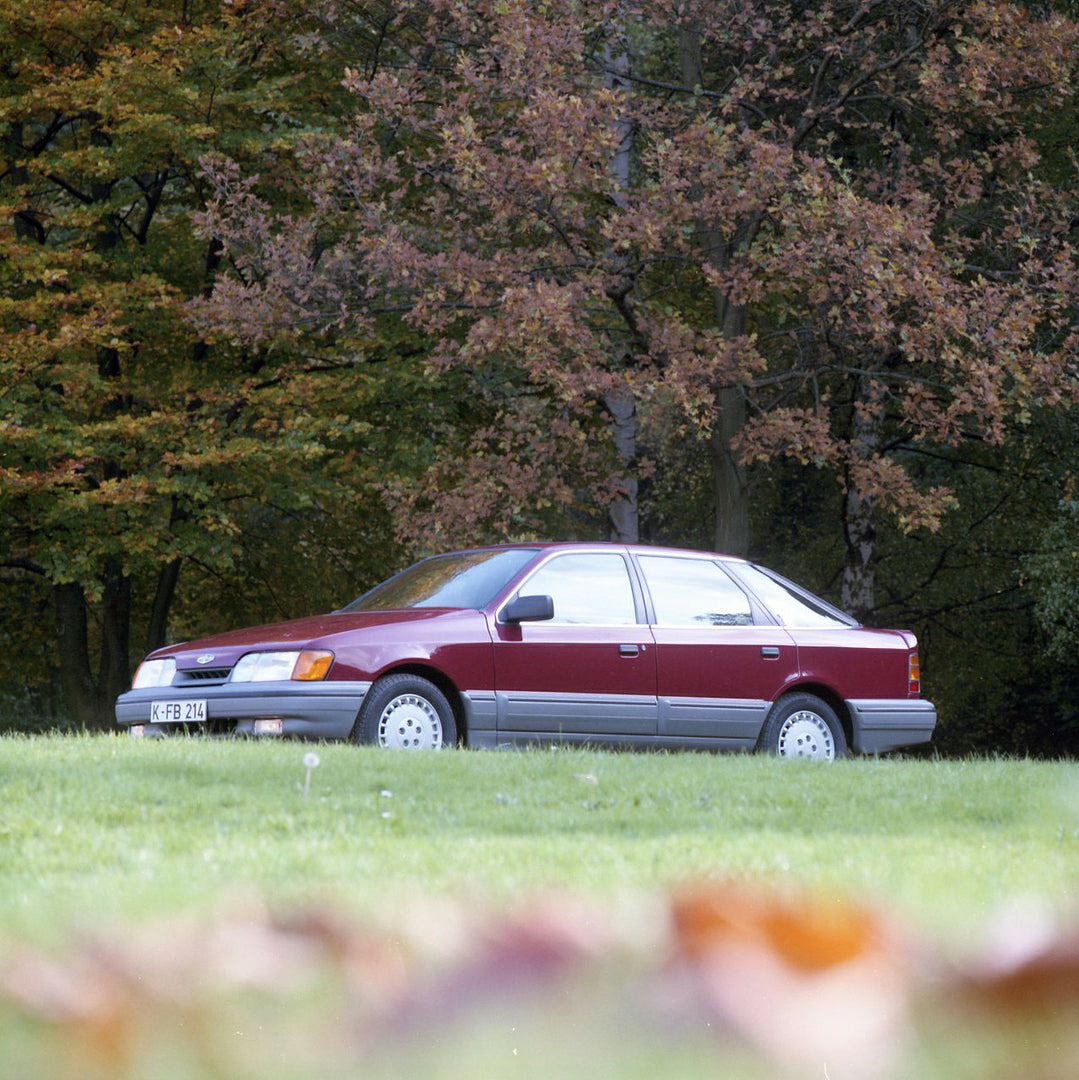 This archival image documents the 1986 Merkur Scorpio low view with scenic trees in Cologne and is preserved in the Ford Heritage Vault as part of Ford Motor Company's historic photographic archive. Free for personal, non-commercial use. Ford Heri...