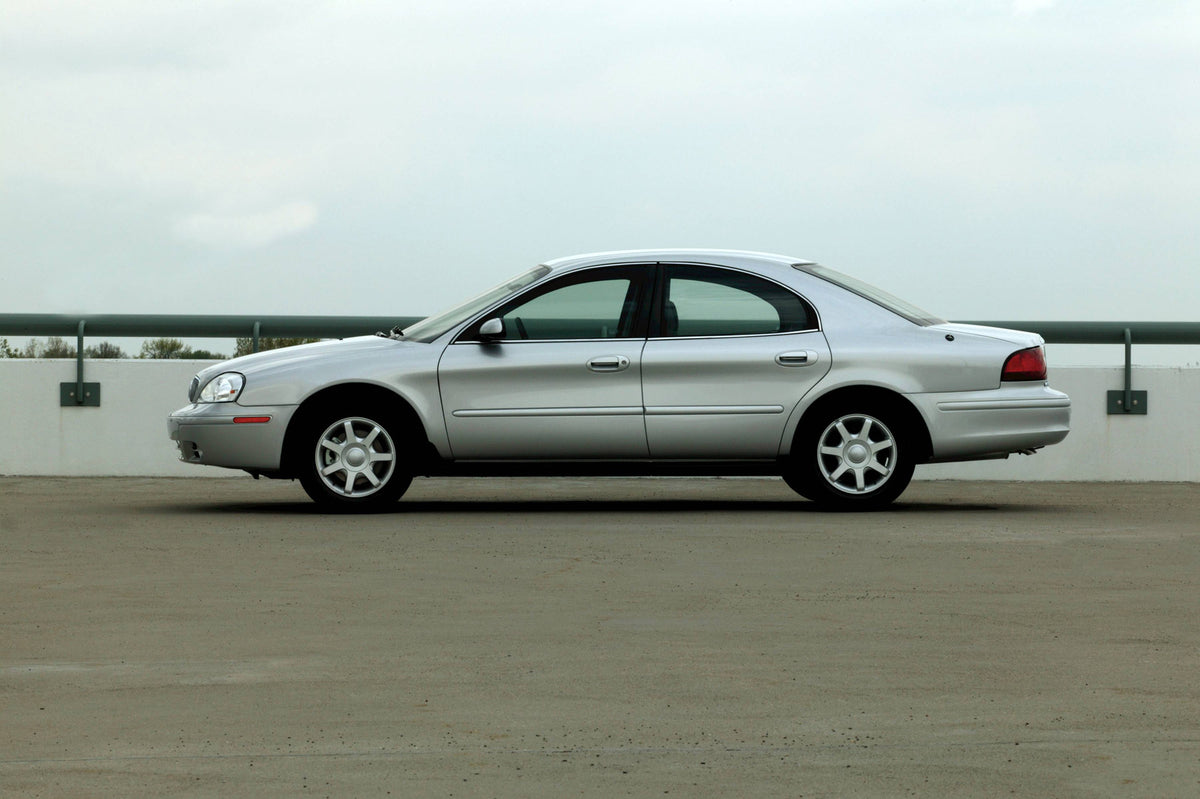 This archival image documents the 2004 Mercury Sable Side View and is preserved in the Ford Heritage Vault as part of Ford Motor Company's historic photographic archive. Free for personal, non-commercial use. Ford Heritage Vault reference AR-2008-...