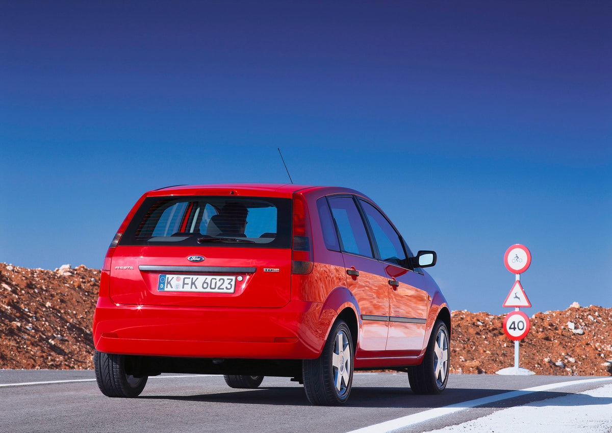 This archival image documents the 2001 Ford Fiesta Mark V rear view on scenic road and is preserved in the Ford Heritage Vault as part of Ford Motor Company's historic photographic archive. Free for personal, non-commercial use. Ford Heritage Vaul...