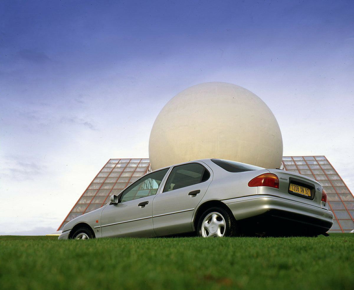This archival image documents the 1992 Ford Mondeo Mark I low rear view near scenic building in Paris and is preserved in the Ford Heritage Vault as part of Ford Motor Company's historic photographic archive. Free for personal, non-commercial use....