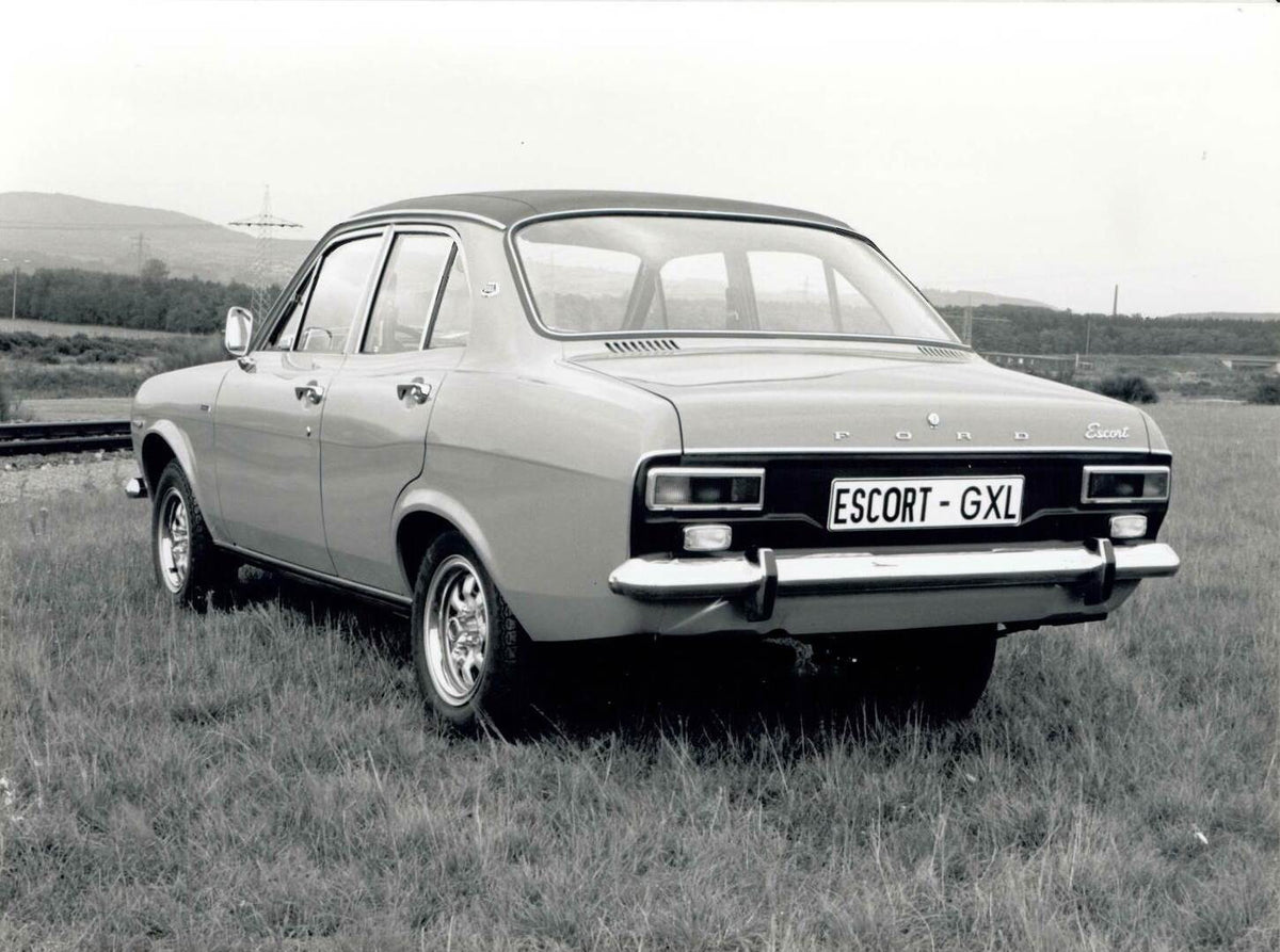 This archival image documents the 1974 Ford Escort Mark I rear view in scenic field Escort-MK1-GLX-1974 and is preserved in the Ford Heritage Vault as part of Ford Motor Company's historic photographic archive. Free for personal, non-commercial us...