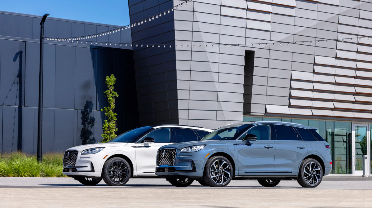 This archival image documents the 2023 Lincoln Corsair Reserve and Grand Touring in front of building and is preserved in the Ford Heritage Vault as part of Ford Motor Company's historic photographic archive. Free for personal, non-commercial use....
