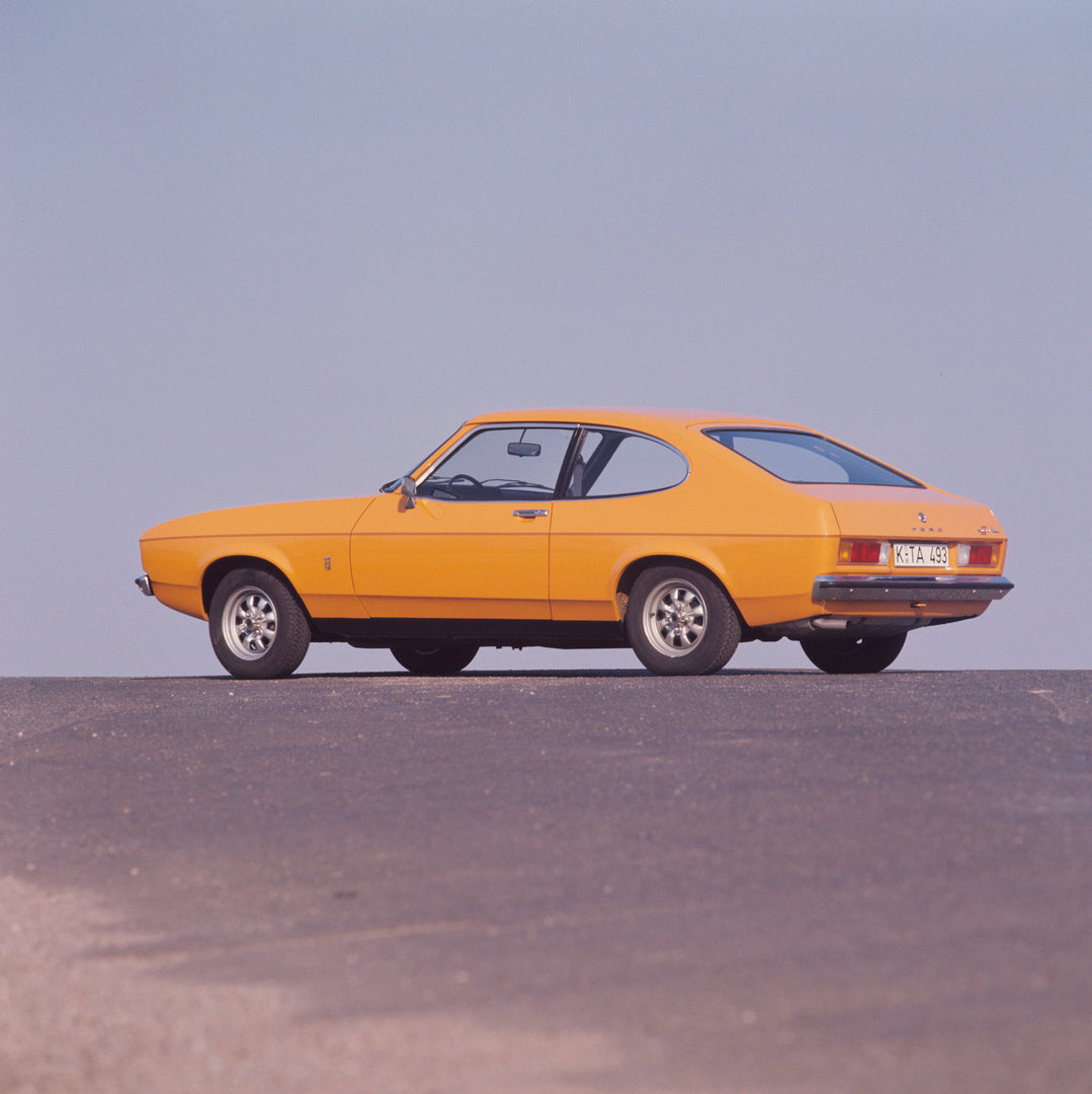 This archival image documents the 1976 Ford Capri II rear view with scenic blue sky and is preserved in the Ford Heritage Vault as part of Ford Motor Company's historic photographic archive. Free for personal, non-commercial use. Ford Heritage Vau...