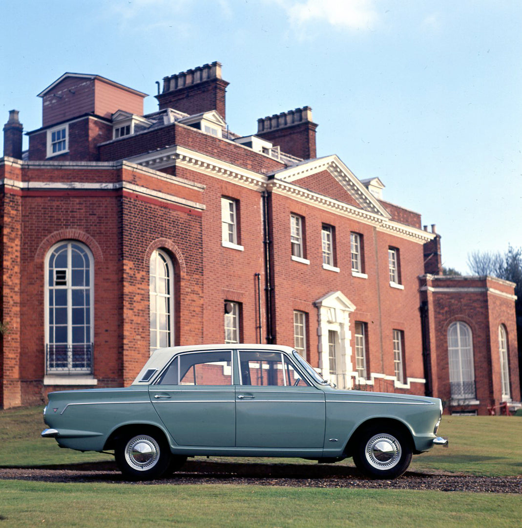 This archival image documents the 1964 Ford Cortina Super MK I side view in front of mansion and is preserved in the Ford Heritage Vault as part of Ford Motor Company's historic photographic archive. Free for personal, non-commercial use. Ford Her...