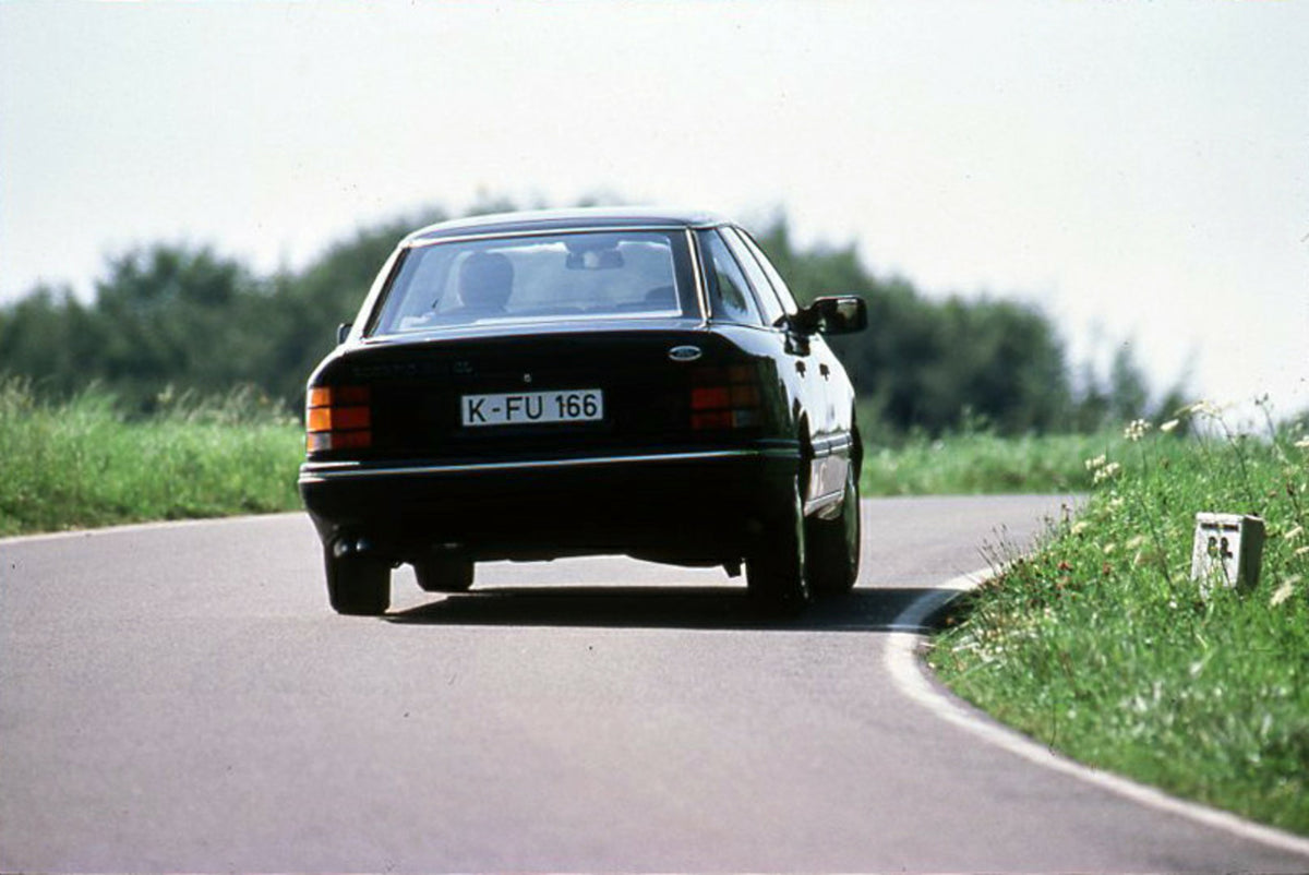 This archival image documents the 1986 Ford Scorpio Mark I rear view on scenic road and is preserved in the Ford Heritage Vault as part of Ford Motor Company's historic photographic archive. Free for personal, non-commercial use. Ford Heritage Vau...