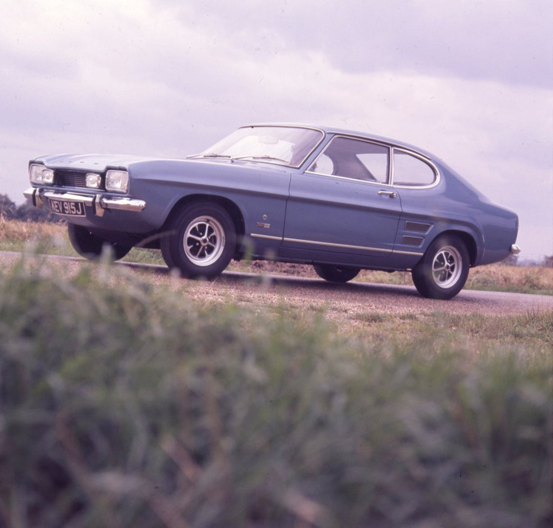 This archival image documents the 1970 Ford Capri MK I 2000 GT on scenic road and is preserved in the Ford Heritage Vault as part of Ford Motor Company's historic photographic archive. Free for personal, non-commercial use. Ford Heritage Vault ref...