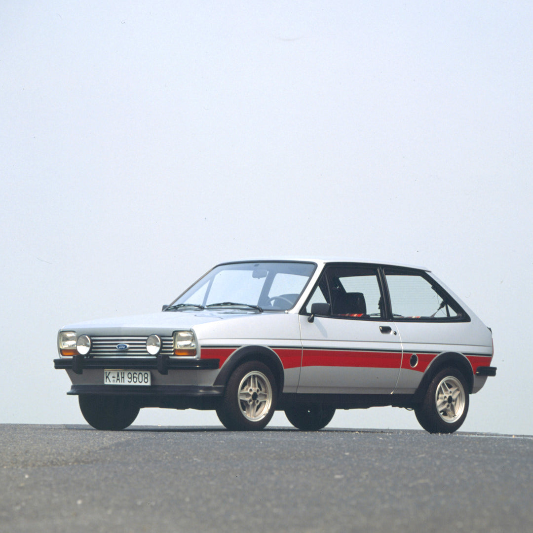 This archival image documents the 1976 Ford Fiesta Mark I Super with scenic blue sky and is preserved in the Ford Heritage Vault as part of Ford Motor Company's historic photographic archive. Free for personal, non-commercial use. Ford Heritage Va...