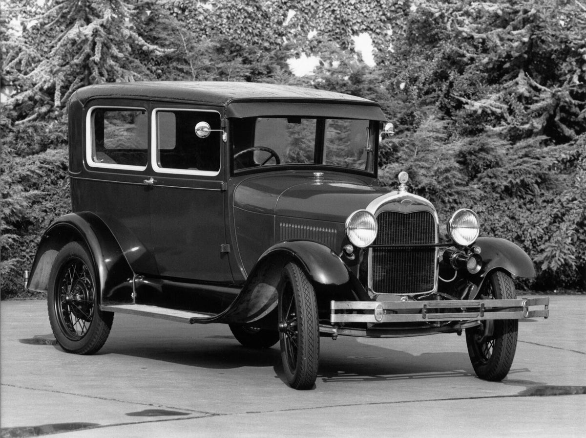 This archival image documents the 1928 Ford Model A with scenic trees and is preserved in the Ford Heritage Vault as part of Ford Motor Company's historic photographic archive. Free for personal, non-commercial use. Ford Heritage Vault reference A...