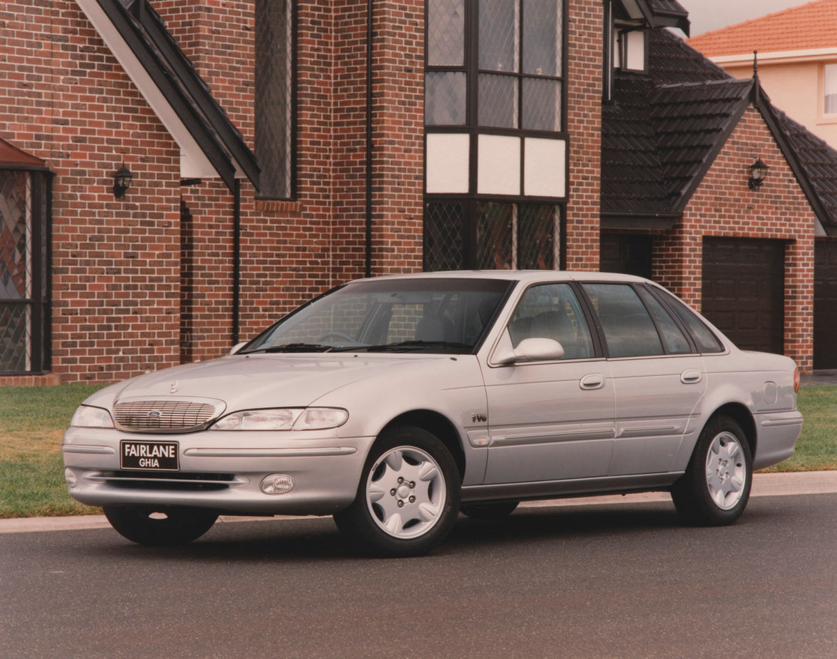 This archival image documents the 1998 Ford Fairlane Ghia Special Edition Sedan 3/4 Front View Outside Brick Building FAP-2011-3 and is preserved in the Ford Heritage Vault as part of Ford Motor Company's historic photographic archive. Free for pe...