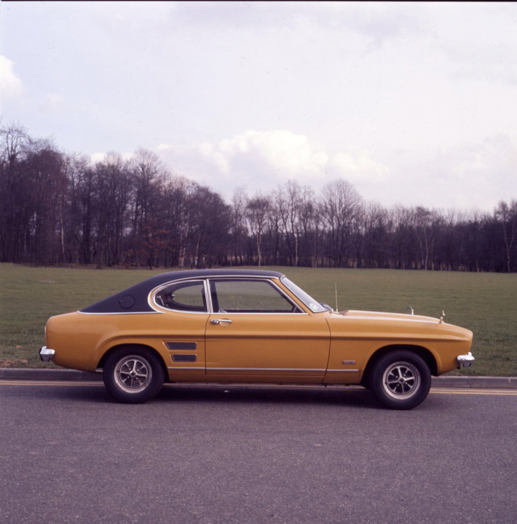 This archival image documents the 1971 Ford Capri MK I 3000E on scenic road and is preserved in the Ford Heritage Vault as part of Ford Motor Company's historic photographic archive. Free for personal, non-commercial use. Ford Heritage Vault refer...