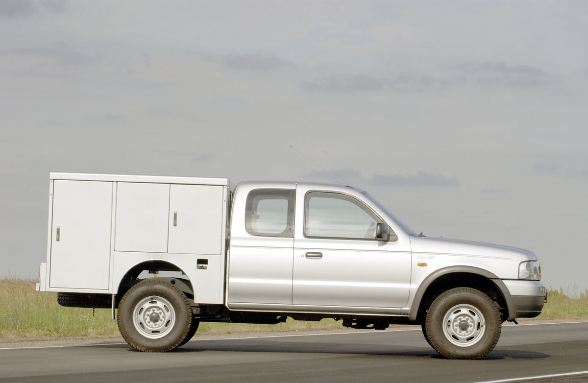 This archival image documents the 2003 Ford Ranger conversion side view on scenic road and is preserved in the Ford Heritage Vault as part of Ford Motor Company's historic photographic archive. Free for personal, non-commercial use. Ford Heritage ...