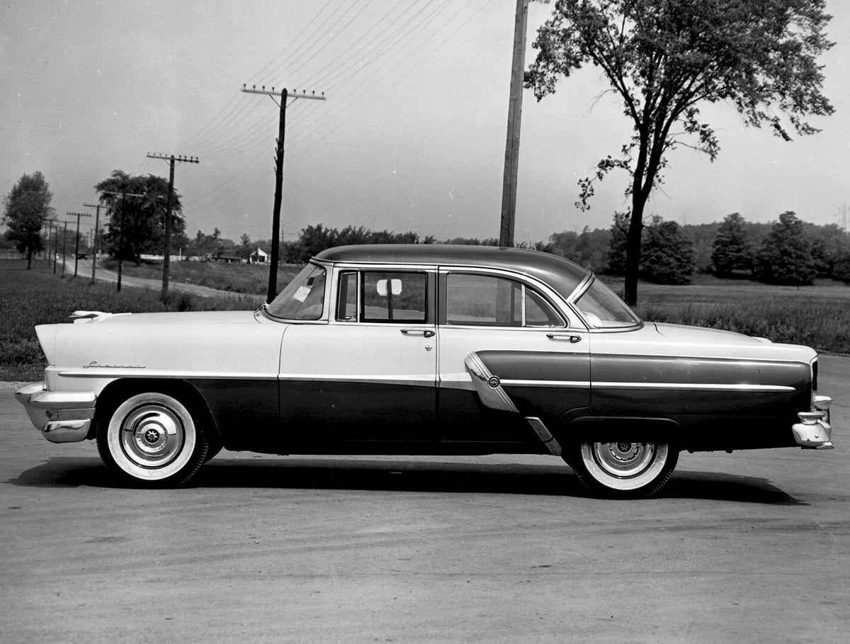 This archival image documents the 1956 March Lucerne Sedan side view on scenic road AR-2007-5 and is preserved in the Ford Heritage Vault as part of Ford Motor Company's historic photographic archive. Free for personal, non-commercial use. Ford He...