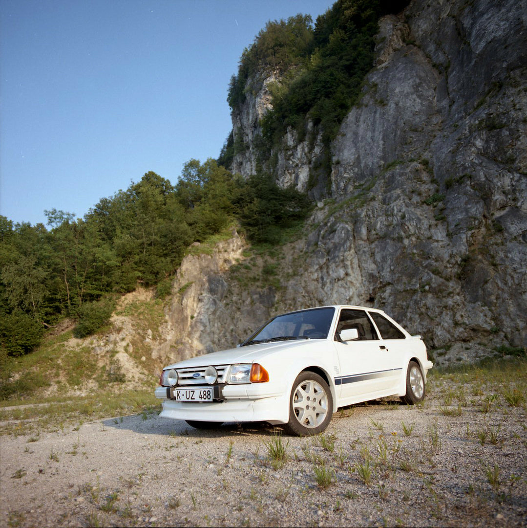 This archival image documents the 1984 Ford Escort Mark III LHD RS Turbo low view with scenic rock formation in Munich and is preserved in the Ford Heritage Vault as part of Ford Motor Company's historic photographic archive. Free for personal, no...