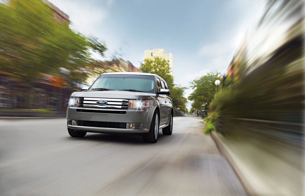 This archival image documents the 2012 Ford Flex action shot on scenic street MS4023 and is preserved in the Ford Heritage Vault as part of Ford Motor Company's historic photographic archive. Free for personal, non-commercial use. Ford Heritage Va...