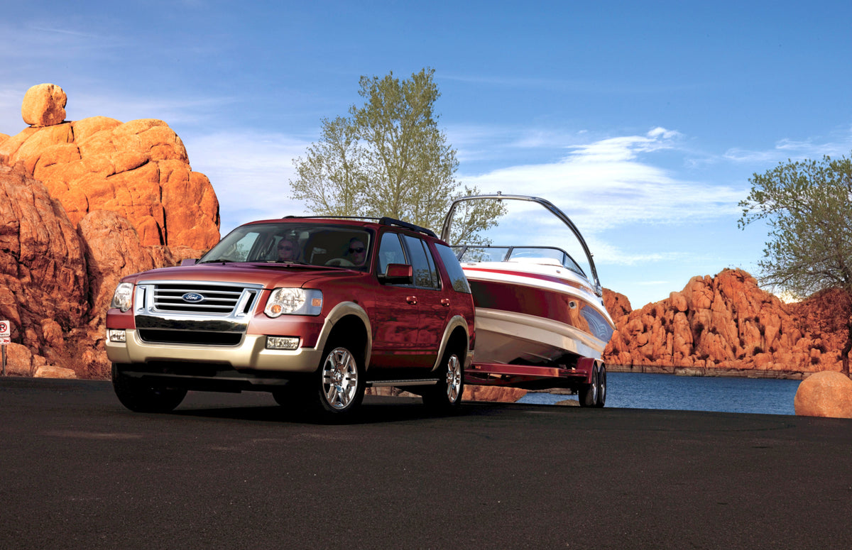 This archival image documents the 2009 Ford Explorer Eddie Bauer towing boat MS367630 and is preserved in the Ford Heritage Vault as part of Ford Motor Company's historic photographic archive. Free for personal, non-commercial use. Ford Heritage V...