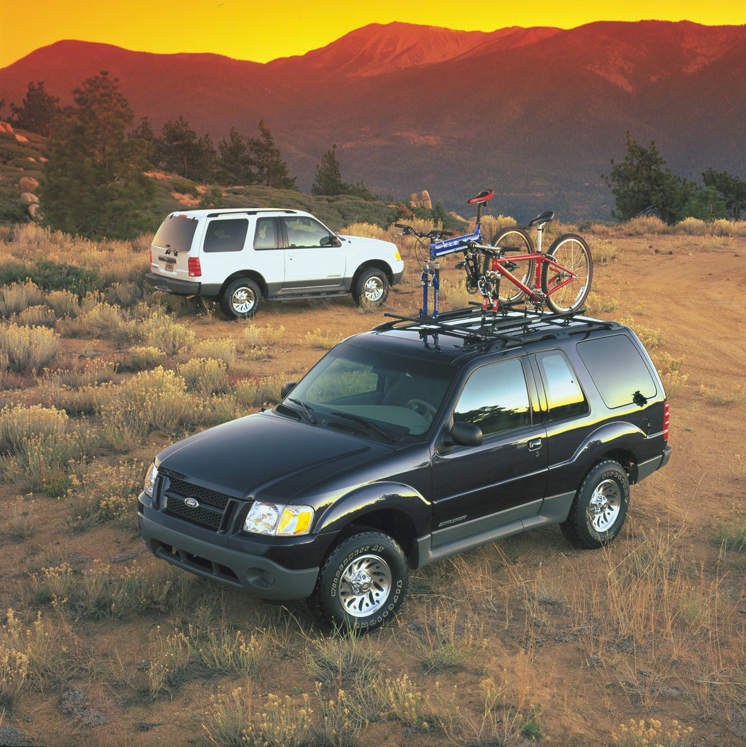 This archival image documents the 1999 Ford Explorer with bike rack and is preserved in the Ford Heritage Vault as part of Ford Motor Company's historic photographic archive. Free for personal, non-commercial use. Ford Heritage Vault reference AR-...