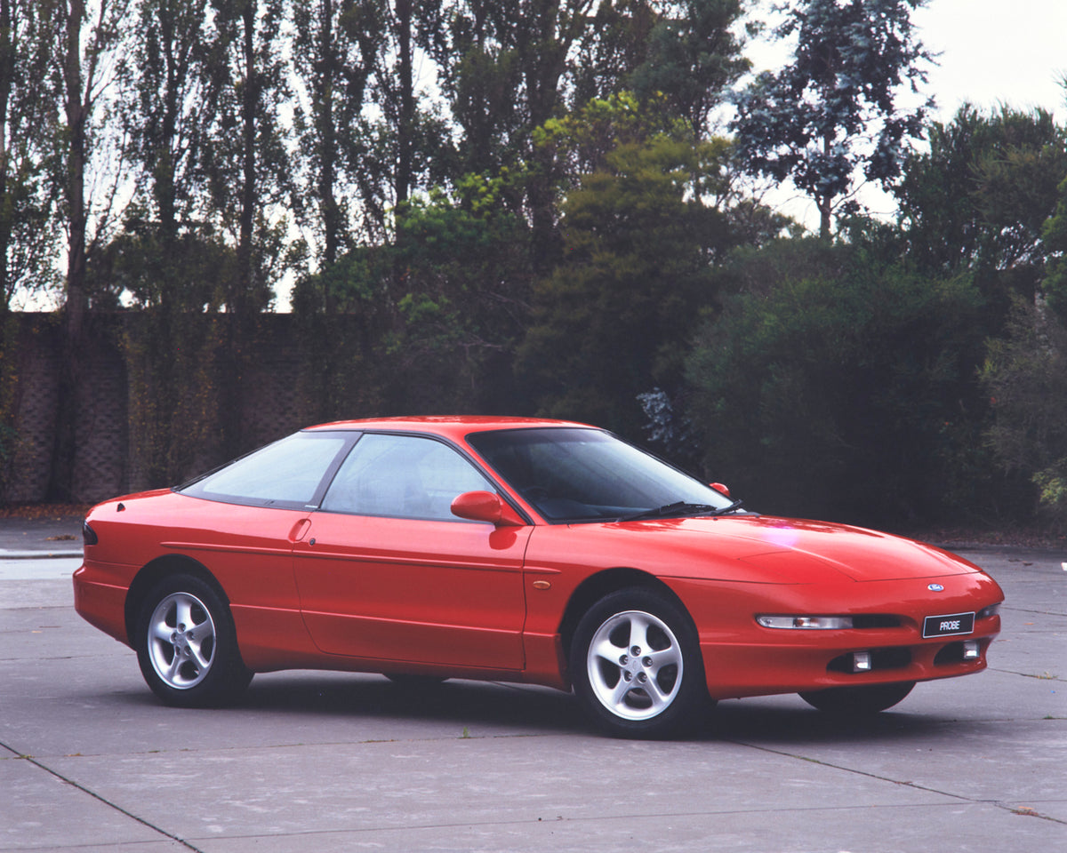 This archival image documents the 1994 Ford Probe Driver Side Front End View in Driveway FAP-2011-3 and is preserved in the Ford Heritage Vault as part of Ford Motor Company's historic photographic archive. Free for personal, non-commercial use. F...