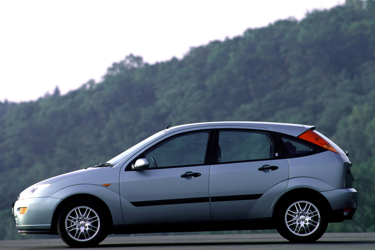 This archival image documents the 2001 Ford Focus Ghia side view with scenic trees MS68624 and is preserved in the Ford Heritage Vault as part of Ford Motor Company's historic photographic archive. Free for personal, non-commercial use. Ford Herit...