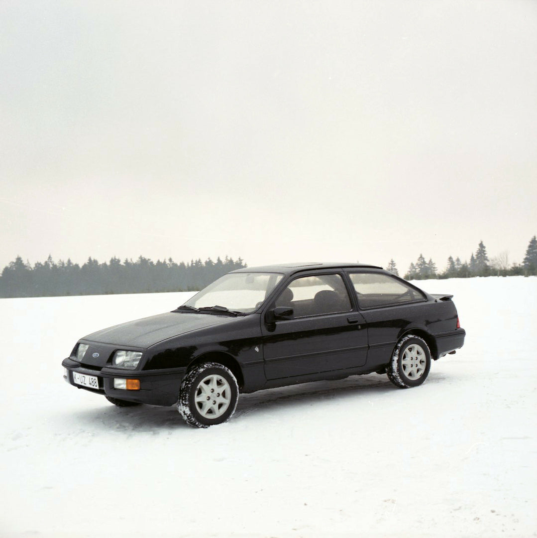 This archival image documents the 1985 Ford Sierra XR 4x4 LHD side view in snow and is preserved in the Ford Heritage Vault as part of Ford Motor Company's historic photographic archive. Free for personal, non-commercial use. Ford Heritage Vault r...
