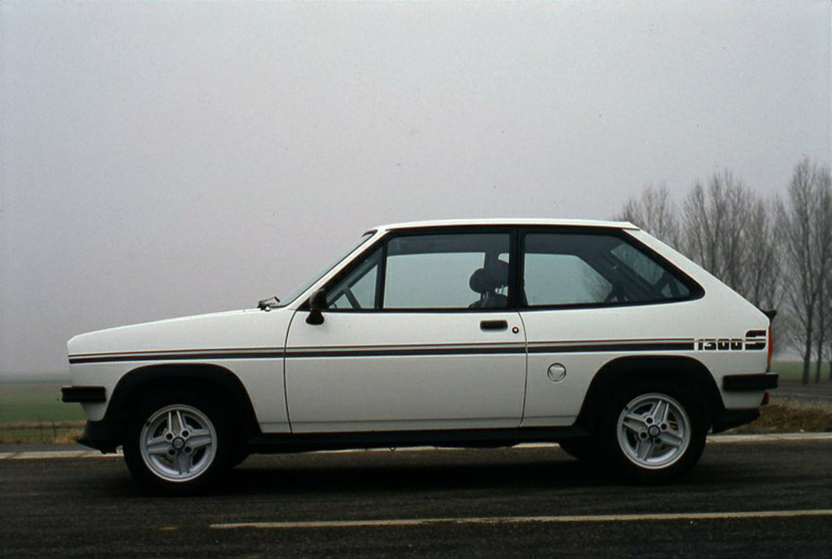 This archival image documents the 1981 Ford Fiesta 1300 S Mark I side view on road and is preserved in the Ford Heritage Vault as part of Ford Motor Company's historic photographic archive. Free for personal, non-commercial use. Ford Heritage Vaul...