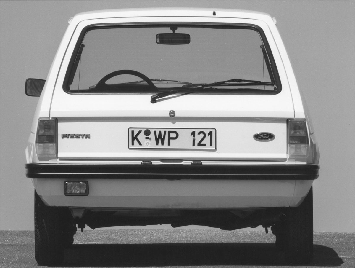 This archival image documents the 1976 Ford Fiesta Mark I rear view on pavement and is preserved in the Ford Heritage Vault as part of Ford Motor Company's historic photographic archive. Free for personal, non-commercial use. Ford Heritage Vault r...