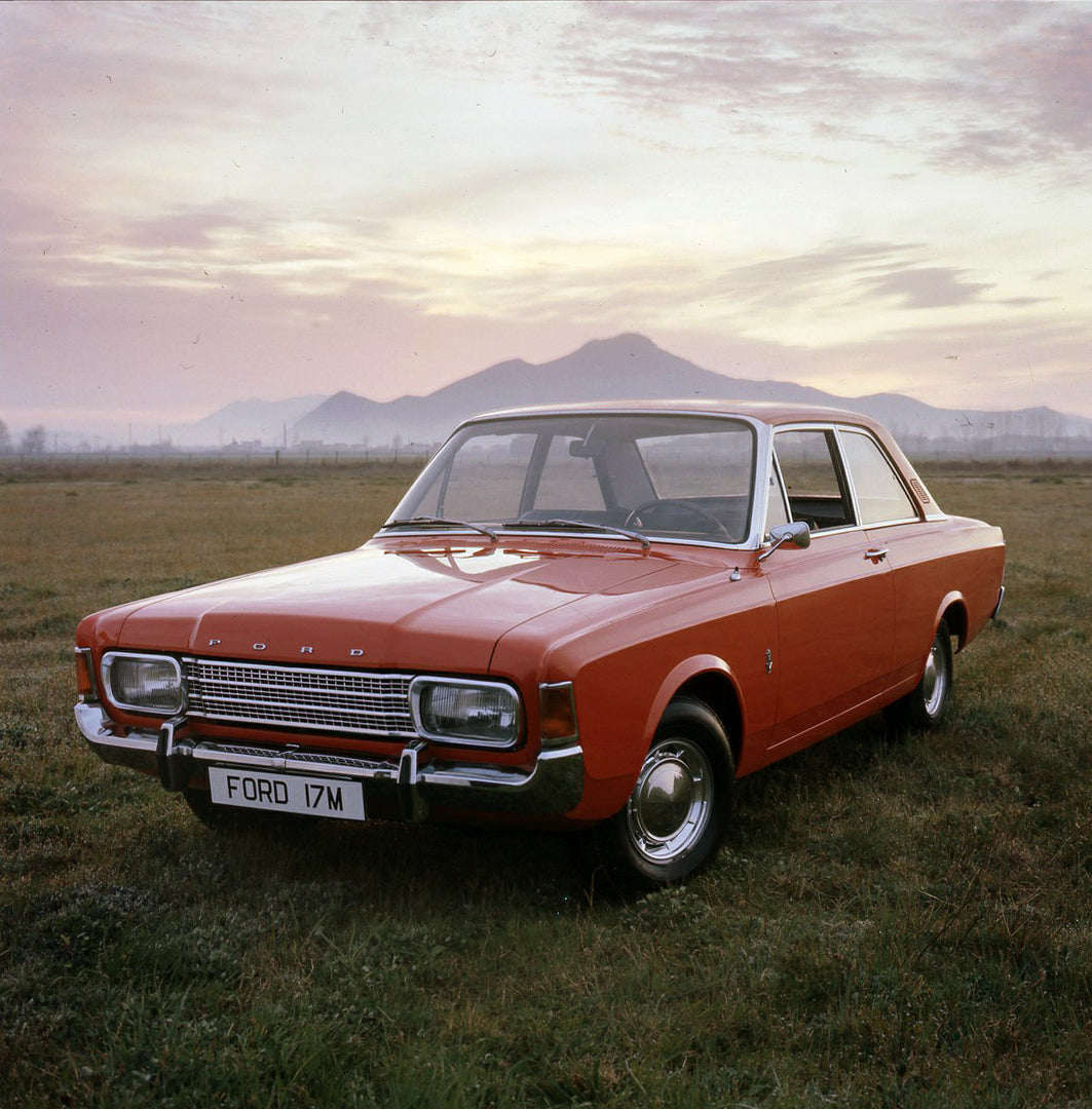 This archival image documents the 1968 Ford Taunus 17M in scenic field with mountains and is preserved in the Ford Heritage Vault as part of Ford Motor Company's historic photographic archive. Free for personal, non-commercial use. Ford Heritage V...