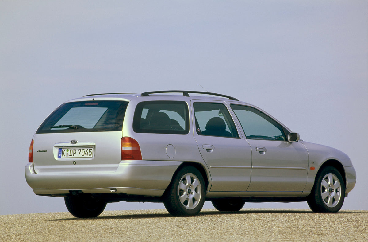 This archival image documents the 1997 Ford Mondeo Mark II rear view with scenic blue sky and is preserved in the Ford Heritage Vault as part of Ford Motor Company's historic photographic archive. Free for personal, non-commercial use. Ford Herita...