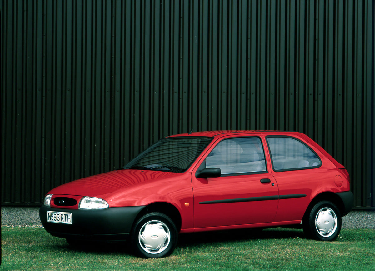 This archival image documents the 1994 Ford Fiesta Mark IV Ghia in front of scenic building and is preserved in the Ford Heritage Vault as part of Ford Motor Company's historic photographic archive. Free for personal, non-commercial use. Ford Heri...