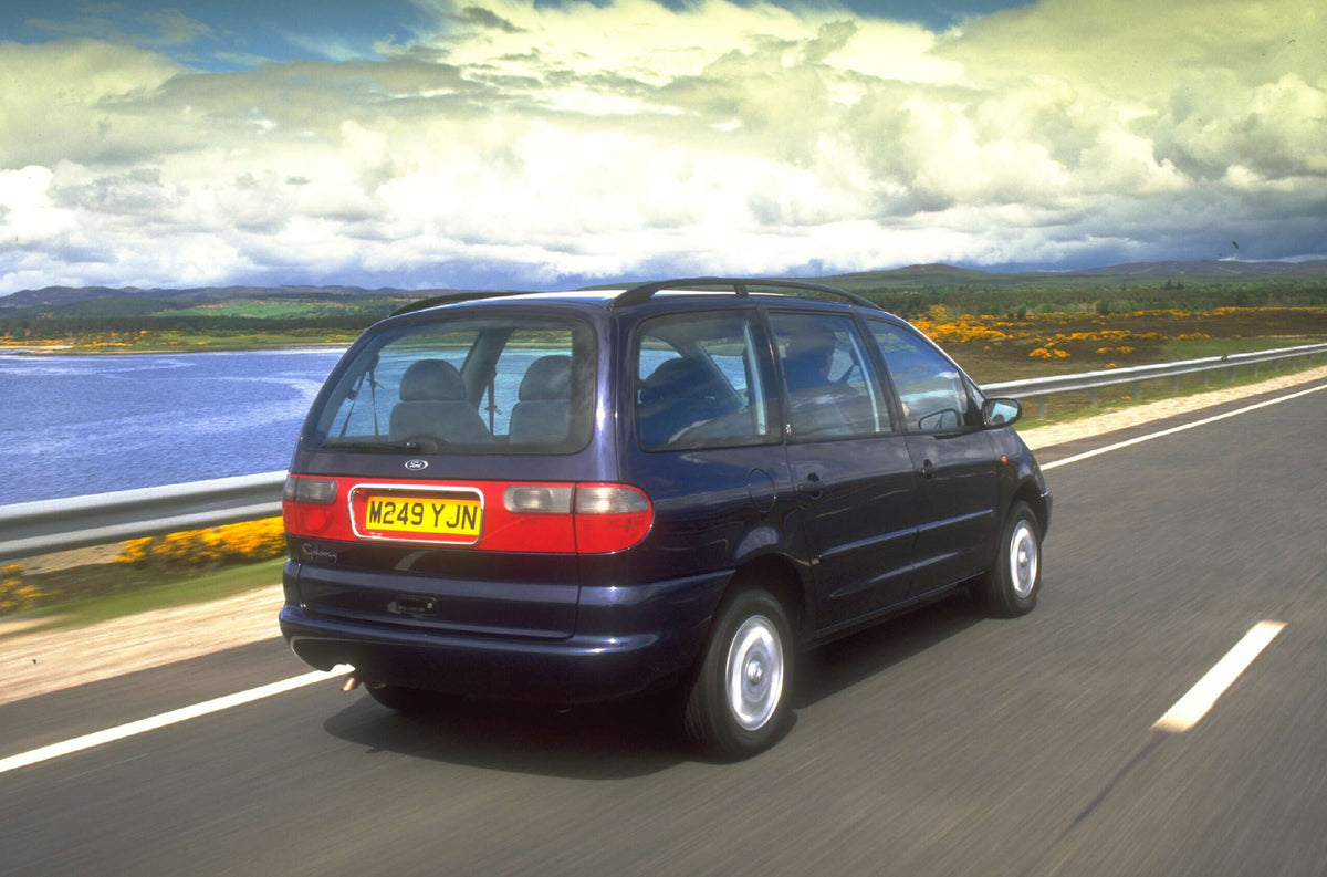 This archival image documents the 1995 Ford Galaxy Mark I Ghia rear view action shot on scenic road AR-2002-213709 and is preserved in the Ford Heritage Vault as part of Ford Motor Company's historic photographic archive. Free for personal, non-co...