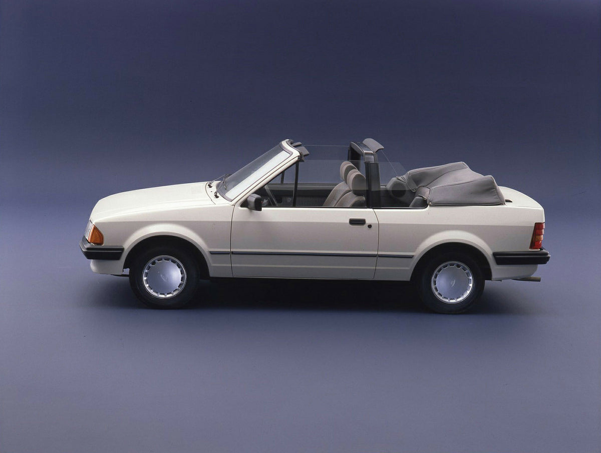 This archival image documents the 1983 Ford Escort Mark III Cabriolet 1.3 GL side view with top down in studio and is preserved in the Ford Heritage Vault as part of Ford Motor Company's historic photographic archive. Free for personal, non-commer...