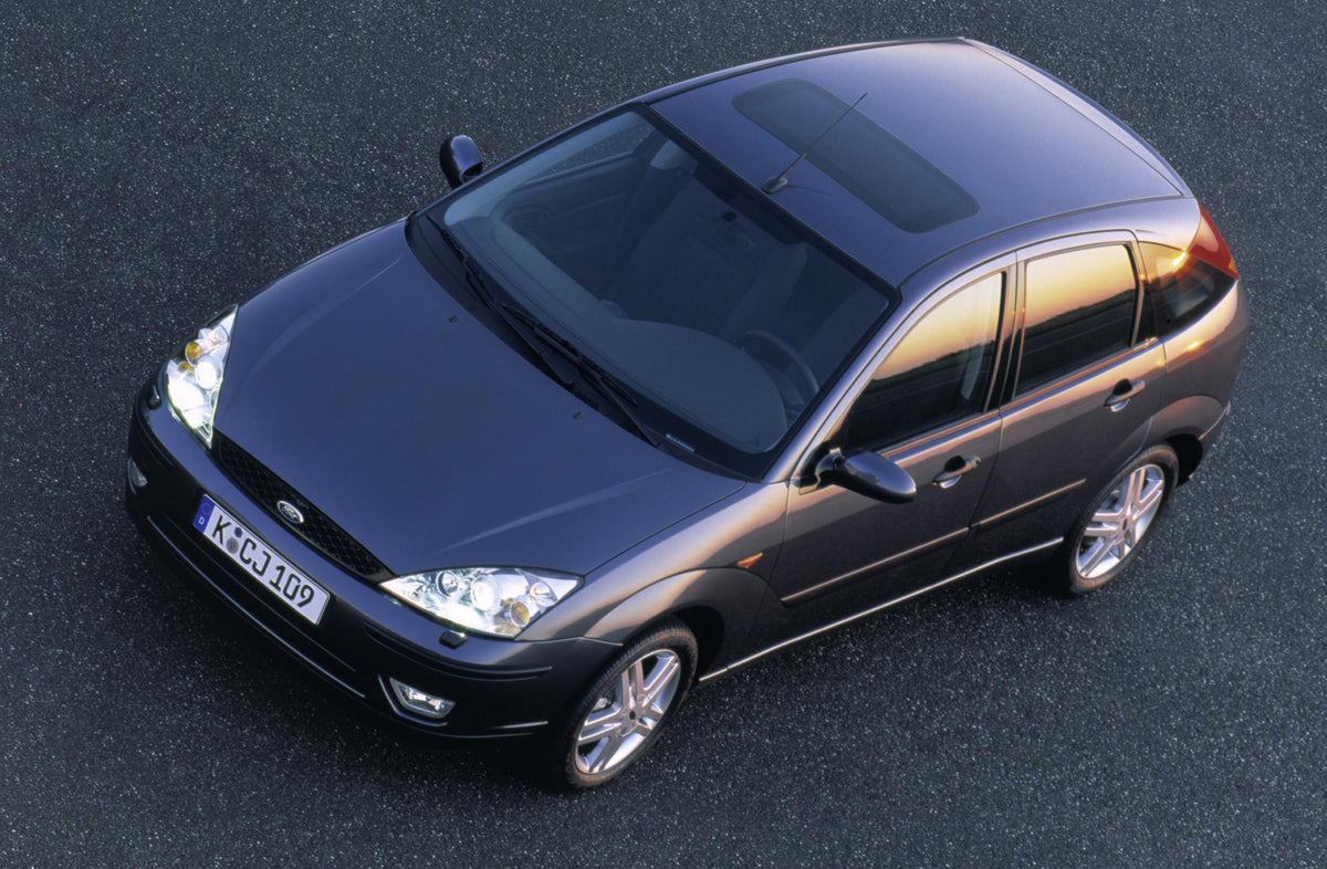 This archival image documents the 2002 Ford Focus Trend aerial view in parking lot MS096744 and is preserved in the Ford Heritage Vault as part of Ford Motor Company's historic photographic archive. Free for personal, non-commercial use. Ford Heri...