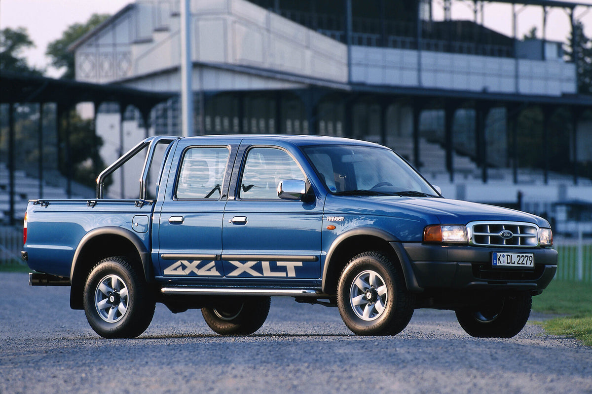 This archival image documents the 2002 Ford Ranger XLT 4x4 in front of scenic building and is preserved in the Ford Heritage Vault as part of Ford Motor Company's historic photographic archive. Free for personal, non-commercial use. Ford Heritage ...