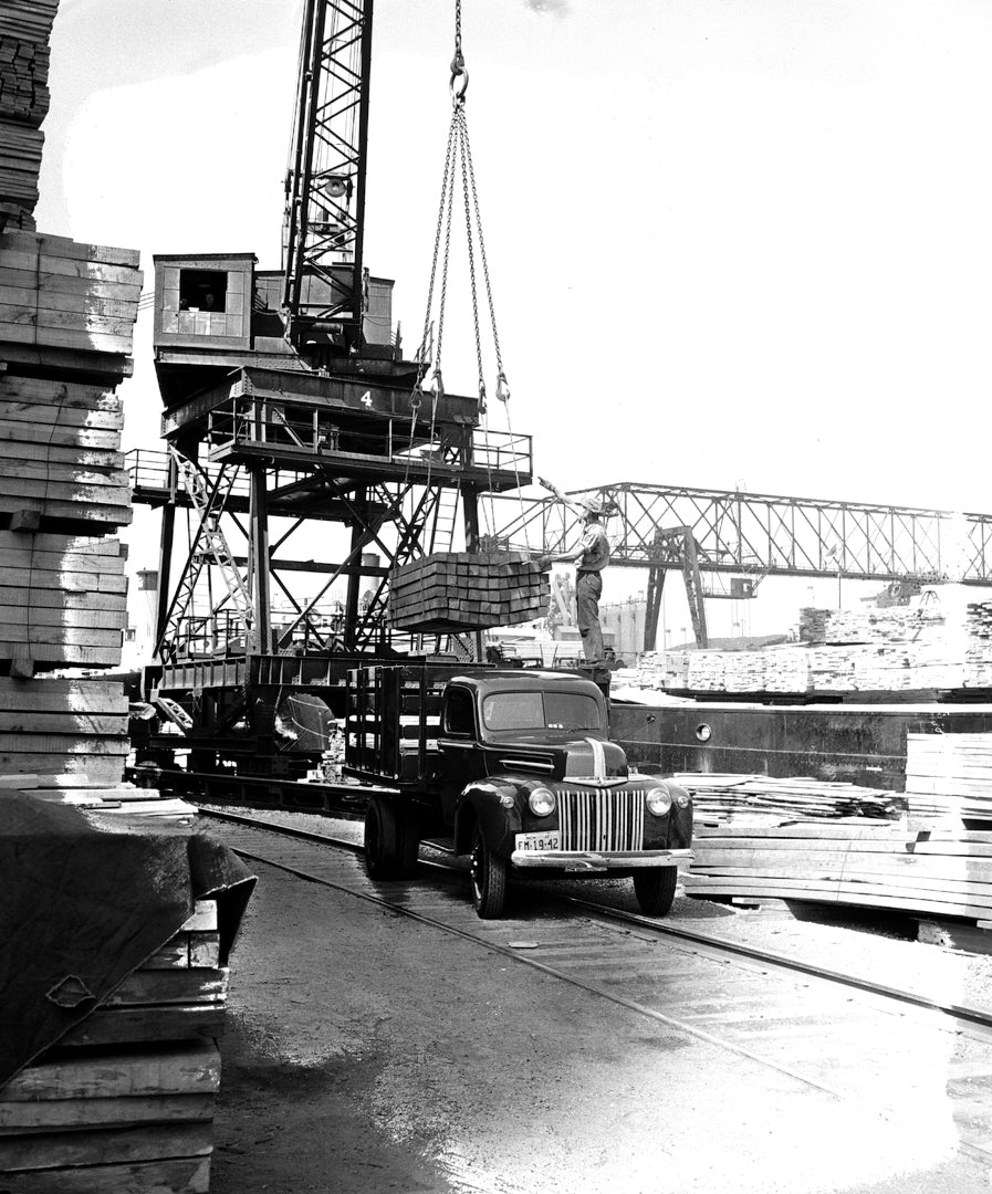 This archival image documents the 1942 Ford Heavy-Duty Regular proto stake truck at work and is preserved in the Ford Heritage Vault as part of Ford Motor Company's historic photographic archive. Free for personal, non-commercial use. Ford Heritag...