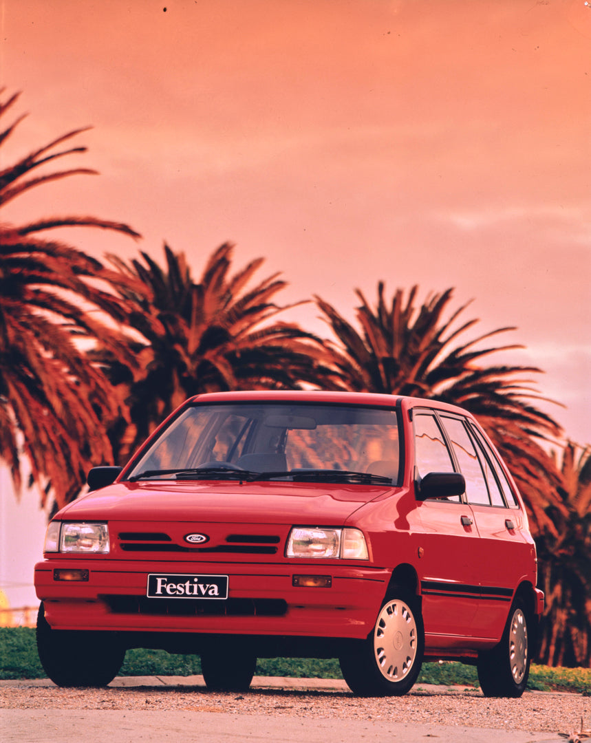 This archival image documents the 1991 Ford WA Festiva Front End View in the Park FAP-2011-3 and is preserved in the Ford Heritage Vault as part of Ford Motor Company's historic photographic archive. Free for personal, non-commercial use. Ford Her...