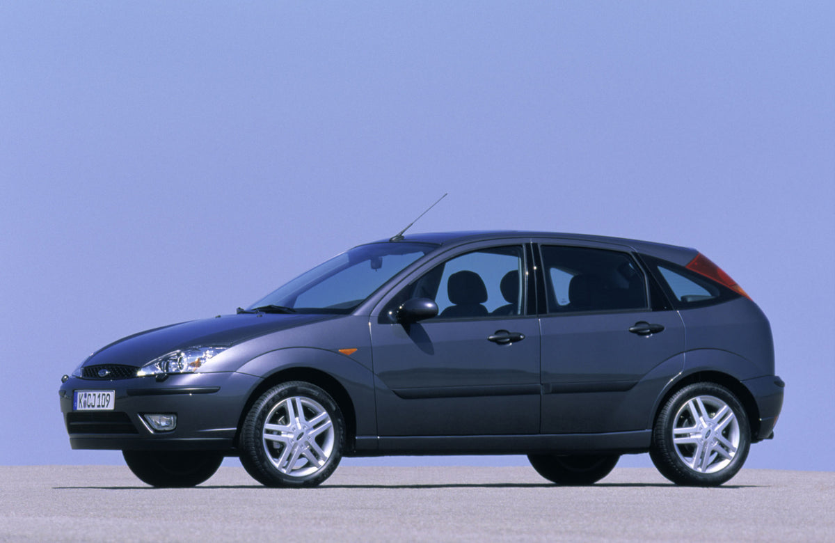 This archival image documents the 2002 Ford Focus Mark I side view with scenic blue sky and is preserved in the Ford Heritage Vault as part of Ford Motor Company's historic photographic archive. Free for personal, non-commercial use. Ford Heritage...