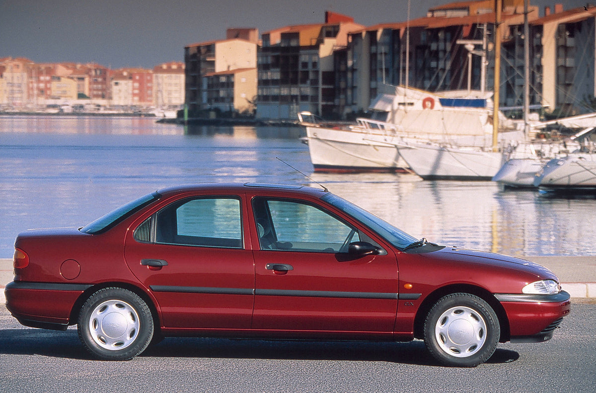 This archival image documents the 1993 Ford Mondeo Mark I side view in scenic harbor and is preserved in the Ford Heritage Vault as part of Ford Motor Company's historic photographic archive. Free for personal, non-commercial use. Ford Heritage Va...
