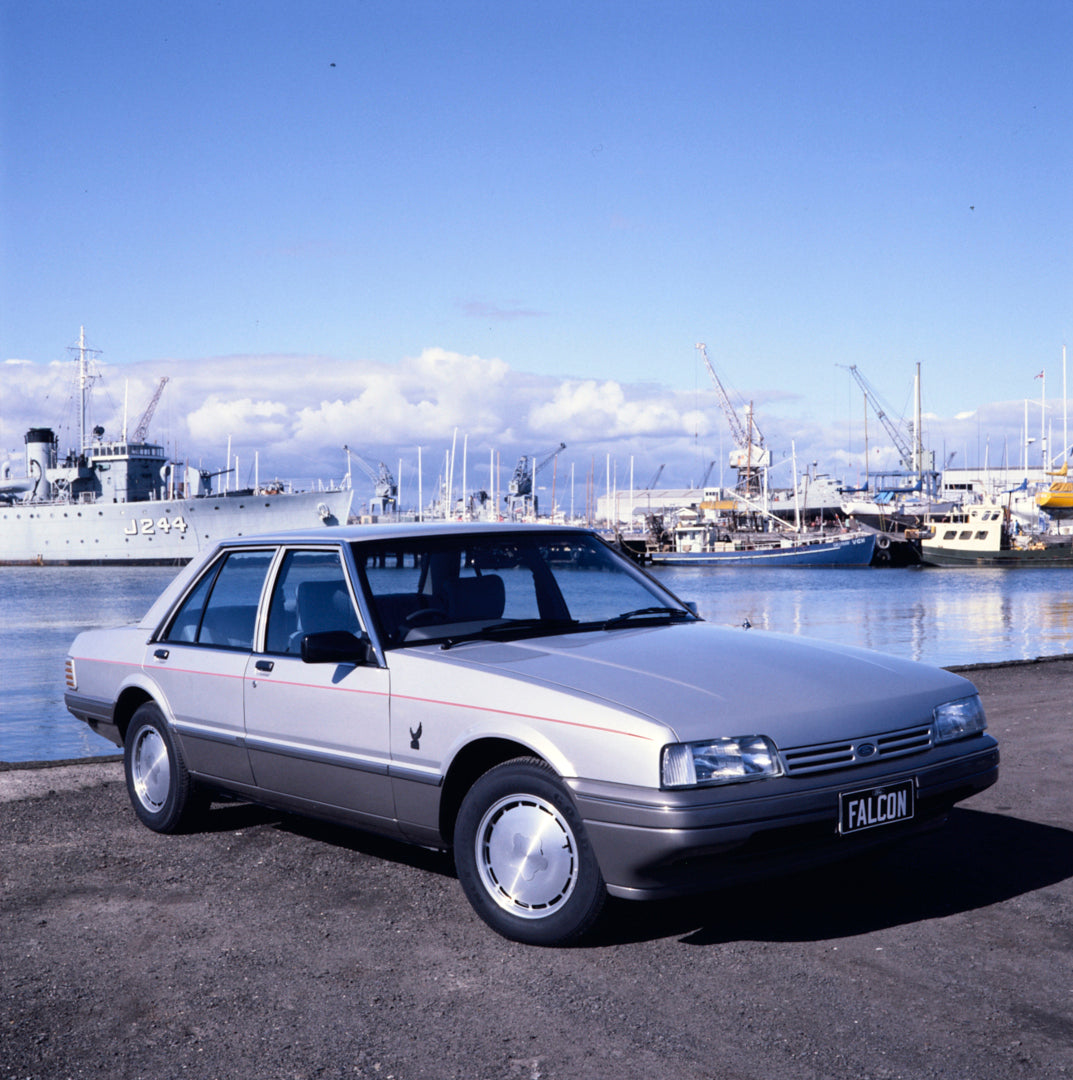 This archival image documents the 1985 Ford XF Falcon Twenty-Fifth Anniversary Edition Sedan Driver Side Front End View at the Harbor FAP-2011-3 and is preserved in the Ford Heritage Vault as part of Ford Motor Company's historic photographic arch...
