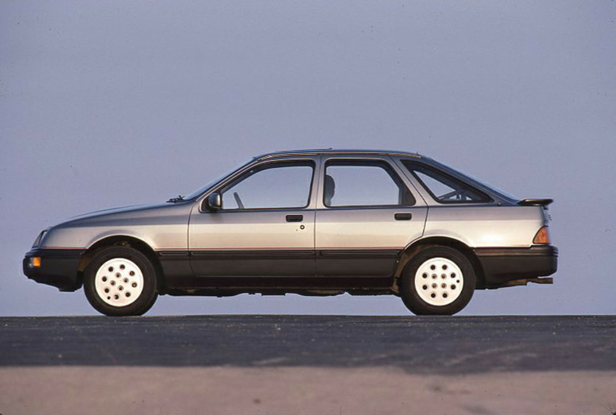 This archival image documents the 1985 Ford Sierra 2.0 IS LHD side view with scenic blue sky and is preserved in the Ford Heritage Vault as part of Ford Motor Company's historic photographic archive. Free for personal, non-commercial use. Ford Her...