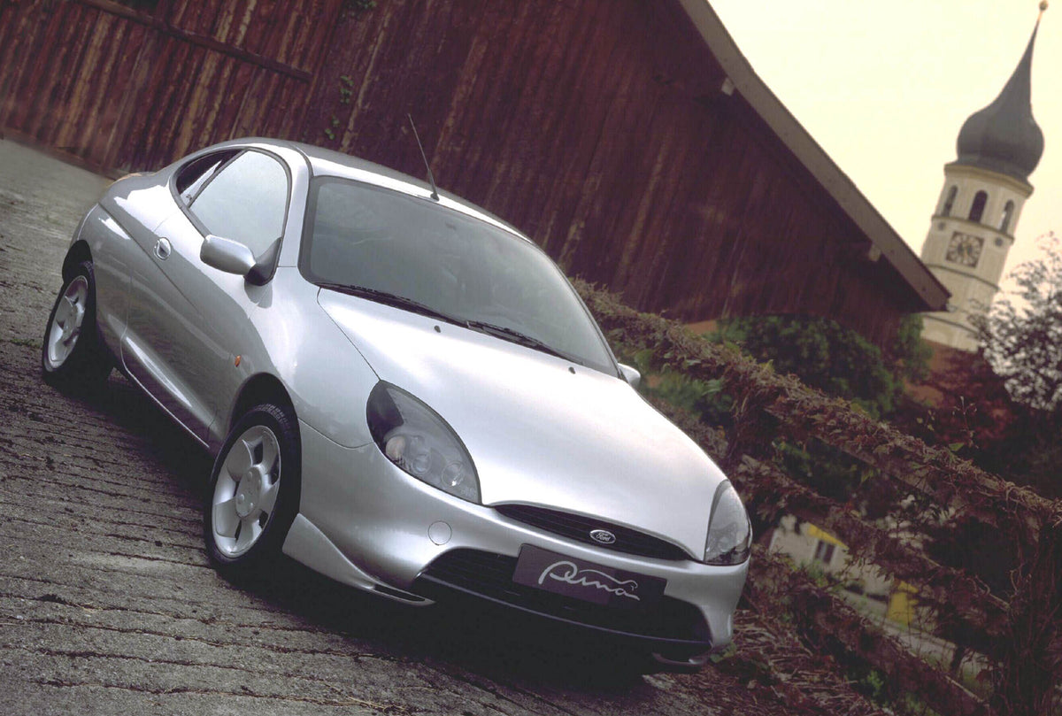 This archival image documents the 1997 Ford Puma in scenic courtyard and is preserved in the Ford Heritage Vault as part of Ford Motor Company's historic photographic archive. Free for personal, non-commercial use. Ford Heritage Vault reference AR...