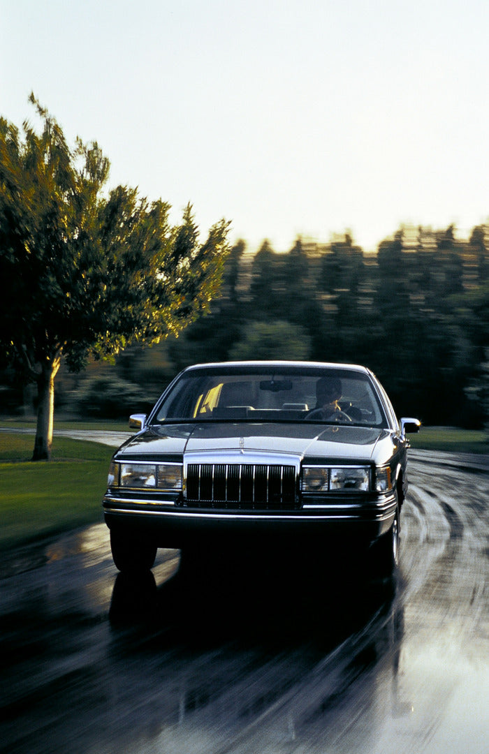This archival image documents the 1992 Lincoln Town Car four-door and is preserved in the Ford Heritage Vault as part of Ford Motor Company's historic photographic archive. Free for personal, non-commercial use. Ford Heritage Vault reference AR-20...
