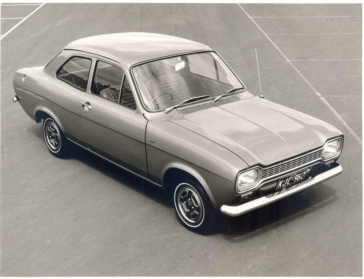 This archival image documents the 1970 Ford Escort Mark I Super aerial view in parking lot and is preserved in the Ford Heritage Vault as part of Ford Motor Company's historic photographic archive. Free for personal, non-commercial use. Ford Herit...