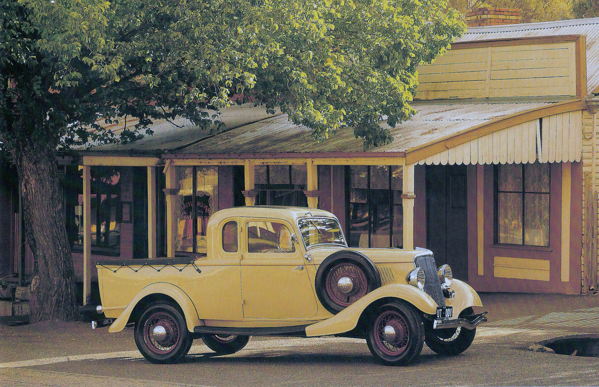 This archival image documents the 1934 Ford Model 40 Ute in front of scenic building with tree and is preserved in the Ford Heritage Vault as part of Ford Motor Company's historic photographic archive. Free for personal, non-commercial use. Ford H...
